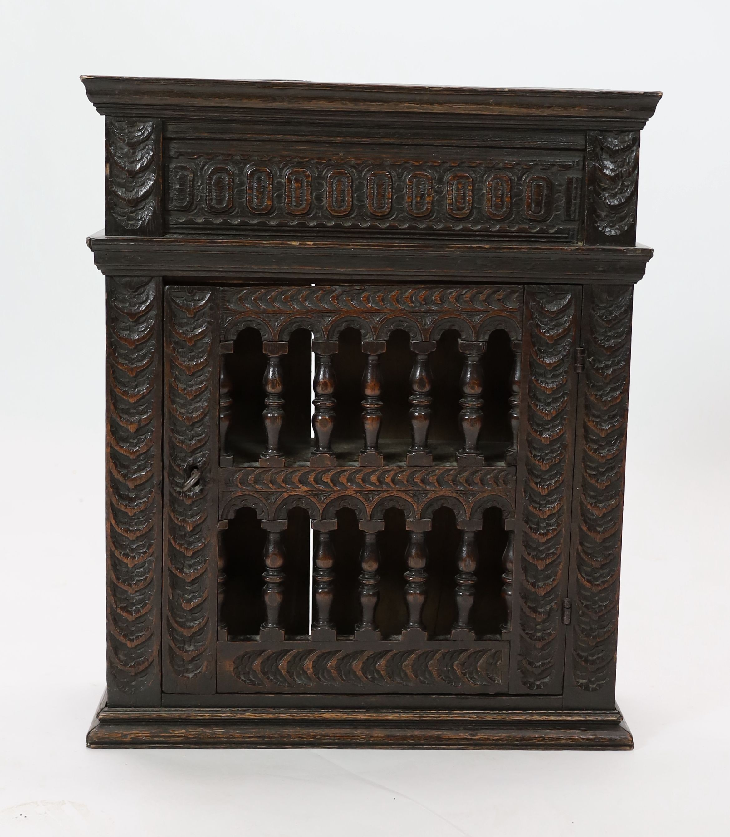 A 17th century oak dole cupboard, width 62cm depth 23cm height 74cm